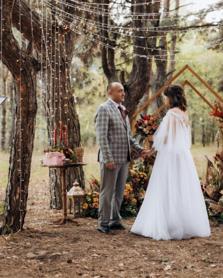 Engaged couple in autumn forest, forest wedding venue, nature wedding ceremony